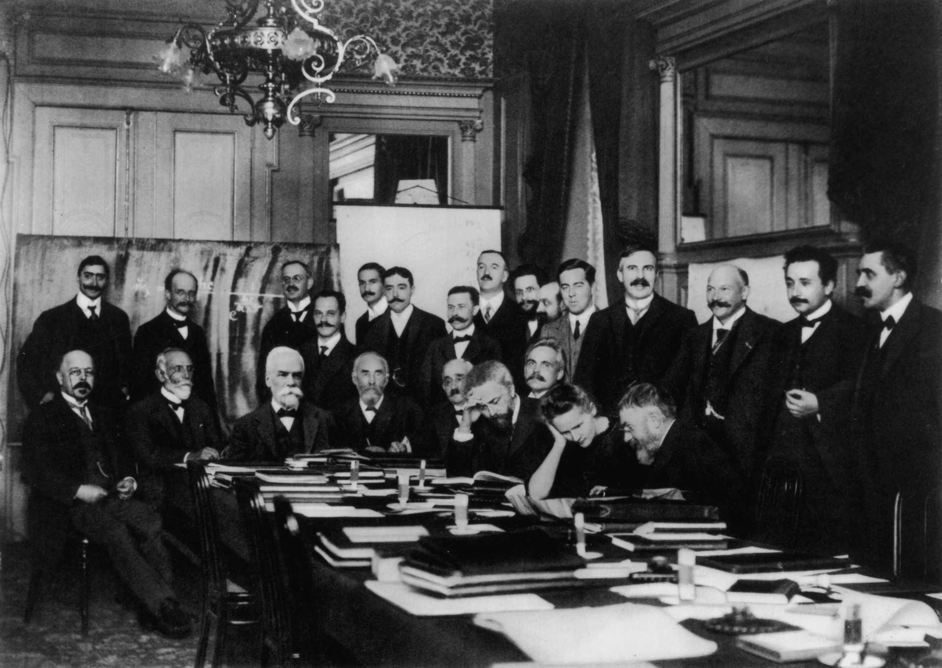 Attends the first Solvay Conference