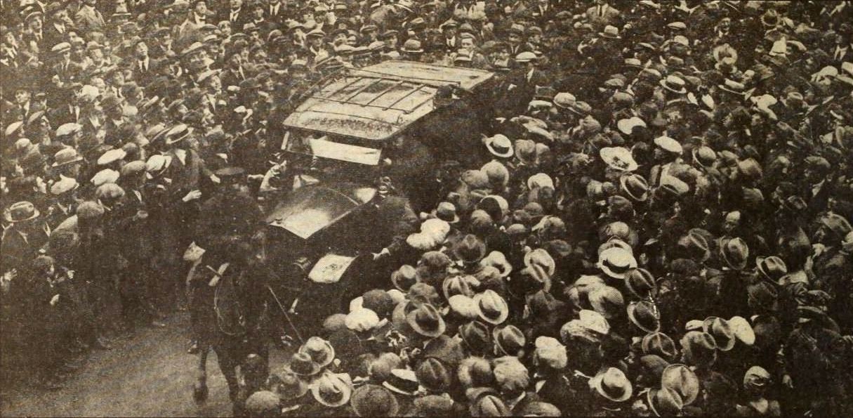 Returns to London in triumph